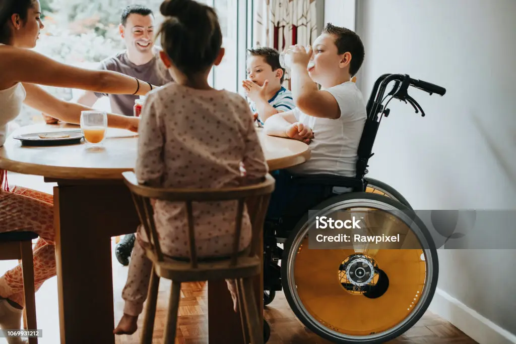 A family sit around a table